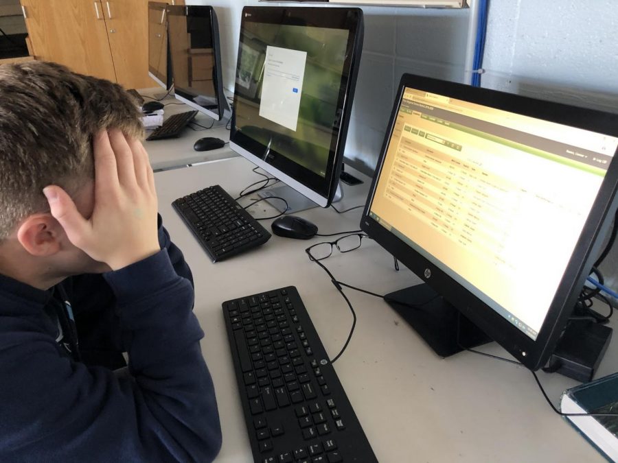 A student feels very stressed after checking his grades in school.
