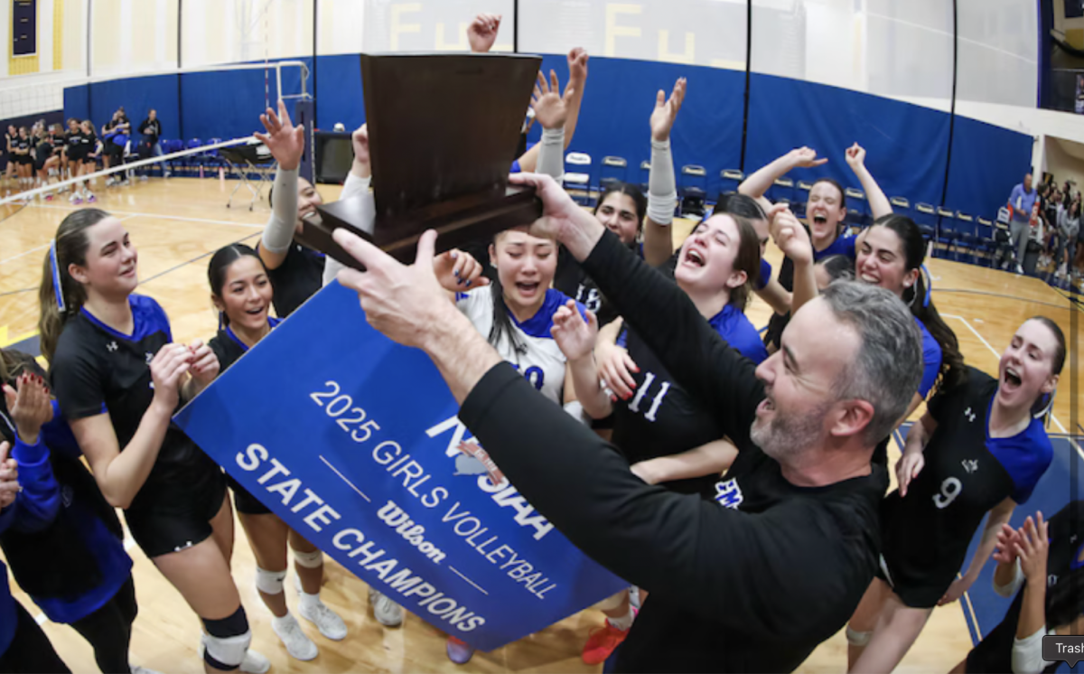 Volleyball team celebrating their win