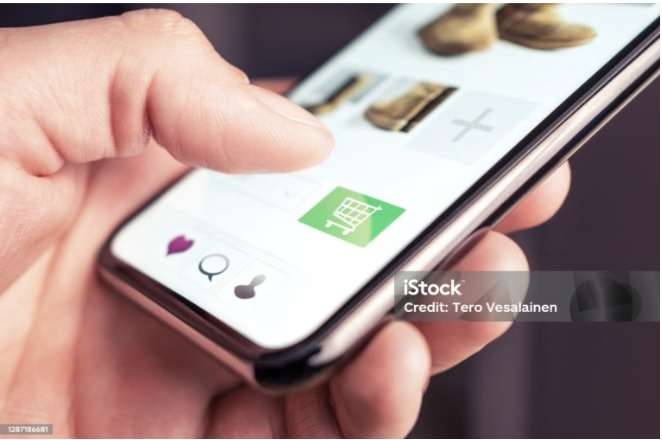 Online shopping and fashion store website with add to cart button in mobile phone.