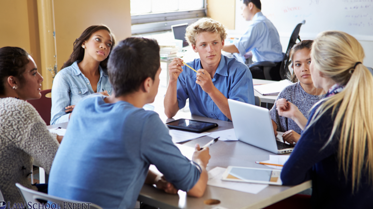 Students engaging in discussion at a club meeting