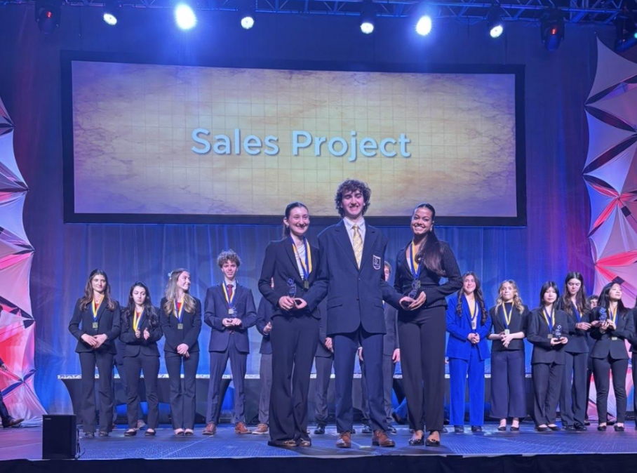 A picture of Ava Pavlos and Samaaya Agarwal winning their award to ICDC. 
