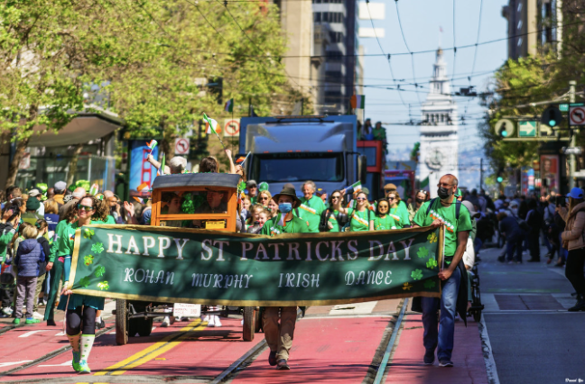 Saint Patrick's Day parade being celebrated with people within the community.